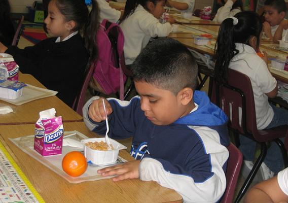 First grader at Reavis Elementary School, a Chicago Public School, eats breakfast in the classroom. (School Breakfast Week, March 2009)