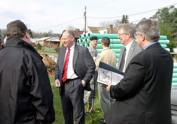 Congressman Mark Critz, center, Col. William H. Graham, District Engineer, US Army Corps of Engineers, back, and Thomas P. Williams, USDA Rural Development State Director, right, talk with local residents at the Washington Township Phase II Sewer Project Groundbreaking on March 21, 2011. 