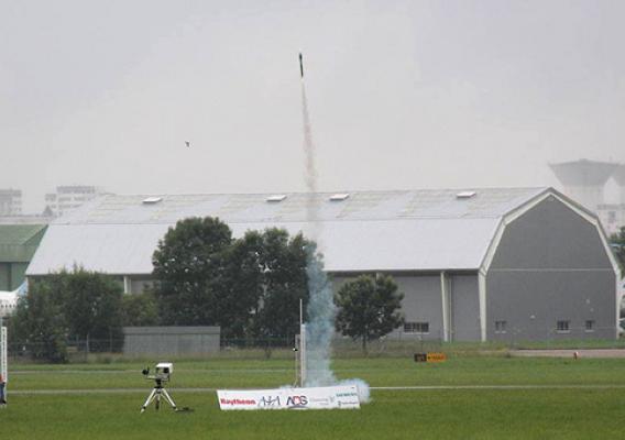 The American team's rocket streaks into the sky over Paris during the International Rocketry Challenge. The photo is courtesy Raytheon.