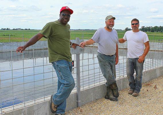 NRCS District Conservationist Lewis Nichols (left) worked with Illinois rancher James “Jim” Johnson and his son Thad on a comprehensive nutrient management plan to best use manure on their land. USDA photo.