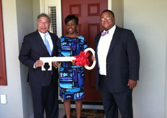 Tony Hernandez (left), Administrator for USDA Housing Programs, and Georgia Rural Development State Director Quinton Robinson congratulate Telisha Mack on her new home in recognition of National Homeownership Month.