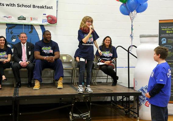 Lilly Ayotte, Fuel Up to Play 60 Student Ambassador, talks with student at Dr. Norman Crisp Elementary School in Nashua, N.H., for the "It Starts With School Breakfast" event.
