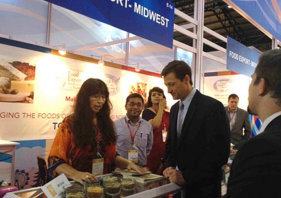 Bev Flaten, of JM Grain, shows Tom Vajda, the U.S. Consul General for Mumbai, products she is showcasing at the Annapoorna World of Food India trade show.