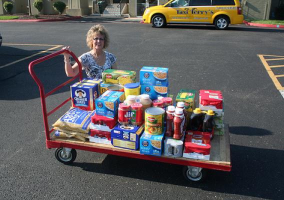 USDA Rural Development State Director for Missouri Anita J. (Janie) Dunning with food donation to Feds Feed Families.