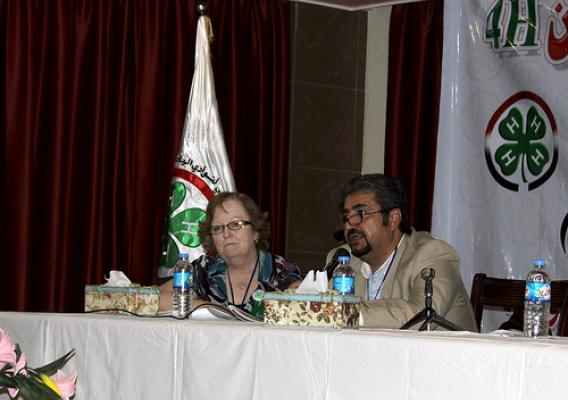  Mary Kerstetter (left), sits next to an Iraqi government official, Salam Singer, at the country’s first National 4-H Conference held in Baghdad in May. Kerstetter recently returned to the United States after more than two years as an agricultural advisor for USDA’s Foreign Agricultural Service (FAS) in Iraq, where she was instrumental in establishing 4-H clubs across the country. Photo courtesy of Mary Kerstetter. 