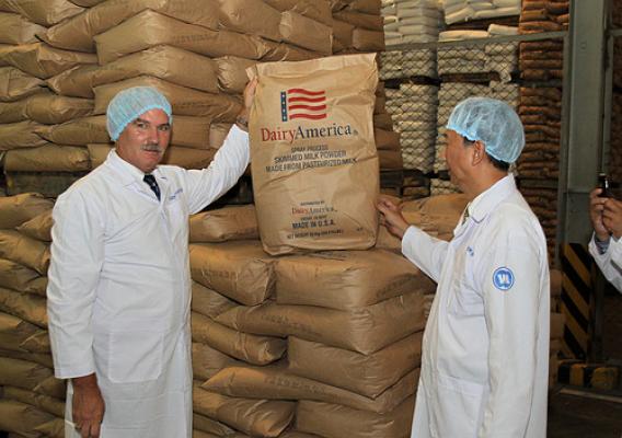 Acting Under Secretary for Farm and Foreign Agricultural Services Michael Scuse (left) tours a Vinamilk factory in Ho Chi Minh City, Vietnam and sees dairy products the company has imported from the United States. Vinamilk is Vietnam’s largest dairy processing company and its general manager, Nguyen Quoc Khanh (right) is a 1998 alum of the Foreign Agricultural Service’s Cochran Fellowship Program. Scuse was in Vietnam last week leading USDA’s first agricultural trade mission there. Photo by Le Sy Hoang Chuo