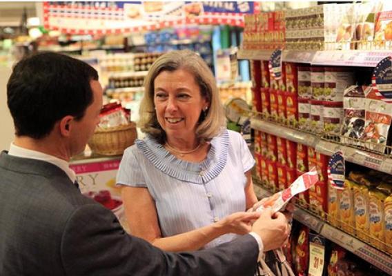 Foreign Agricultural Service Acting Administrator Suzanne Heinen discusses U.S. products with Ralph Bean, director of the Agricultural Trade Office in Beijing, during a BHG promotional event.