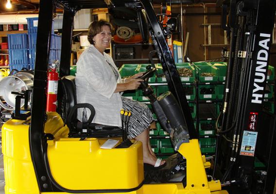 USDA Rural Development’s State Director checks out one of two new forklifts at ProWorks, Inc. in Litchfield, Minn.