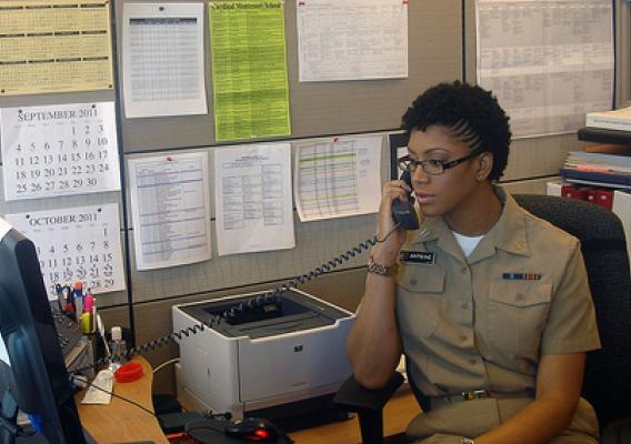 Lt. Nisha Antoine, in her U.S. Public Health Service Commissioned Corps uniform, works at her desk in one of the Food Safety and Inspection Service’s headquarters offices. 