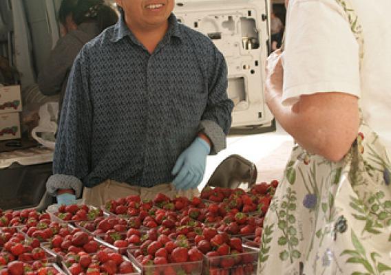 “NIFA’s Beginning Farmer and Rancher Development Program funds projects to help train individuals in areas like agribusiness. Here, a program participant sells his goods at a farmer’s market in Minnesota. ” (Photo credit: Hli Xyooj)