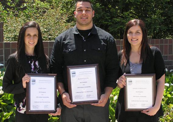 Fresno State University students Caitlin Guest (far left), Aki Dionisopoulos (center), and Amanda Jo Bettencourt (right) receive plaques from AMS.   These students were the 2011 recipients of the AMS Assistantship.  All three currently work with AMS.