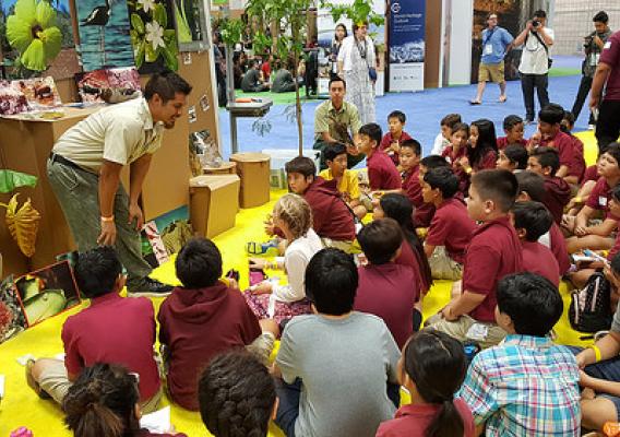 Forest Service staff with members of the Hawaii Division of Forestry and Wildlife teaching children