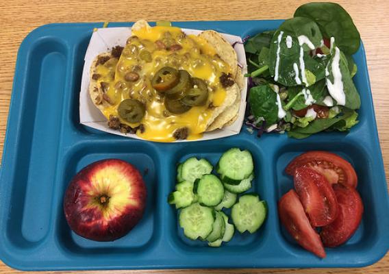Lunch at a Weld County School District 6 elementary school featuring local products: grass-finished beef, pinto beans, local certified organic apples and greenhouse tomatoes & cucumbers