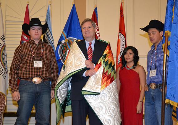 Agriculture Secretary Tom Vilsack presented with a blanket from the Pine Ridge Reservation, S.D.