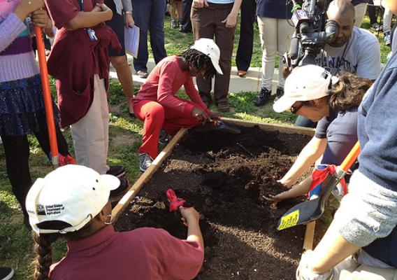 Students from Columbia Heights Educational Campus participate in the symbolic first dig in their new garden.  The People’s Garden will grow food for both the school and people in need. 