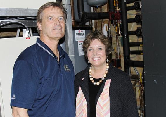 Freeborn Lumber Company owner John Miller and USDA Rural Development State Director Colleen Landkamer inside the room that operates Freeborn’s geothermal system.  The system was installed with support from USDA Rural Development.