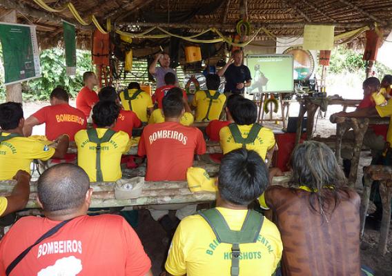 Fire brigades in the Brazilian Amazon listen to Scott Dehnisch, a U.S. Forest Service employee.  Photo courtesy of Forrest Behm.
