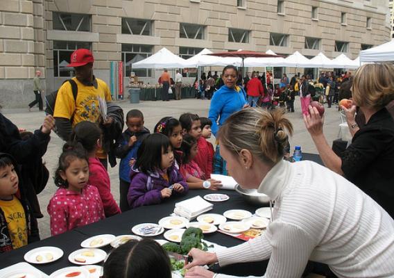 Katherine Tallmadge, DCMADA President, and Sarah Fisher, DCMADA PR Representative and the elementary students from DCPS schools (District of Columbia Public Schools), on Food Day. 