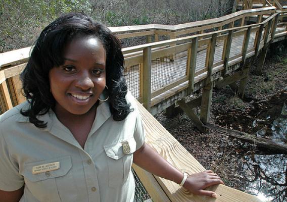 Toni Addison, a civil engineer for the National Forests in Florida, is pictured here at Leon Sink Geological Area on the Apalachicola National Forest. The renovation of Leon Sinks was one of several projects completed in 2011 under the American Recovery and Reinvestment Act. Addison inspected the work of local contractors and businesses to ensure that contract specifications were adhered to and the project was completed in a timely manner. Photo Credit: Susan Blake, Public Affairs Specialist, National Fores