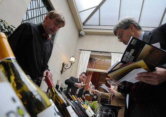 Brothers Geert (left) and Jan Desmet (center), owners of Vinam, a California wine specialist company in Belgium, offer samples to guests at the March 7 wine tasting organized by the Foreign Agricultural Service (FAS) in cooperation with the Wine Institute.  (Photo Courtesy of the U.S. Embassy in Belgium)Brothers Geert (left) and Jan Desmet (center), owners of Vinam, a California wine specialist company in Belgium, offer samples to guests at the March 7 wine tasting organized by the Foreign Agricultural Serv