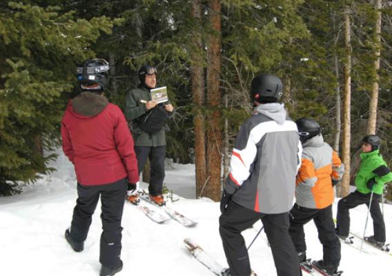 Volunteer snow ranger Conradt Fredell shares his love of skiing and the beautiful landscape of the Arapaho National Forest by taking Loveland Ski Area visitors on an educational tour. The ski area is entirely on Forest Service land. (U.S. Forest Service)