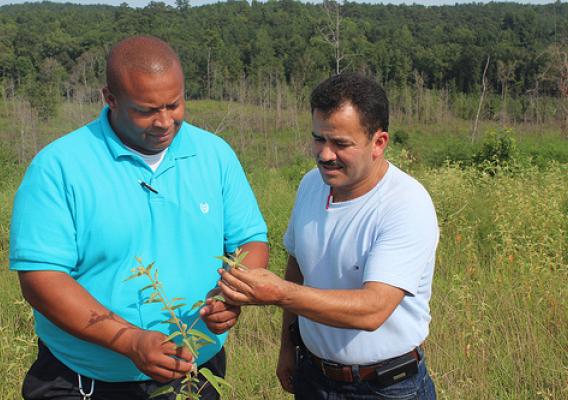 NRCS Supervisory District Conservationist Kelvin Jackson worked with Variano “Chino” Suarez in Mississippi on improving forested lands with conservation programs. NRCS photo.