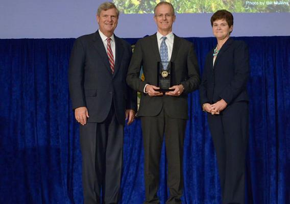 Agriculture Secretary Tom Vilsack and Agriculture Deputy Secretary Krysta Harden present the Secretary’s Honor Award to the Pioneers Alliance group leader Michael S. Stevens at the U.S. Department of Agriculture 66th Annual Honor Awards Ceremony in Washington, D.C. USDA photo by Lance Cheung.
