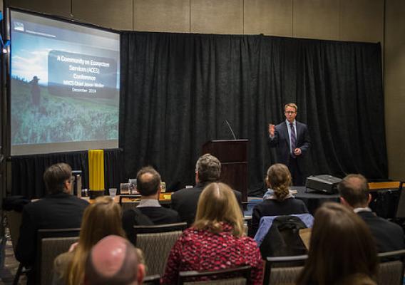 At the ACES conference last week, NRCS Chief Jason Weller (standing) outlined USDA’s approach to incorporating ecosystem services and environmental markets into its conservation mission. USDA Photo by Bob Nichols.