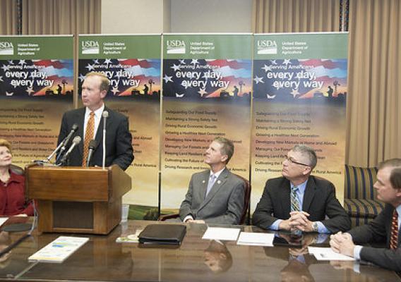 General Motors Global Public Policy Executive Director Greg Martin speaks at a press conference announcing the completion of the first-of-its kind purchase of verified carbon credits generated on working ranch lands by Chevrolet, at the U.S. Department of Agriculture (USDA), in Washington, D.C. on Monday, Nov. 17, 2014. (L to R Senator Debbie Stabenow (MI), General Motors Global Public Policy Executive Director Greg Martin, Ducks Unlimited Paul Schmidt, The Climate Trust Executive Director Sean Penrith, and