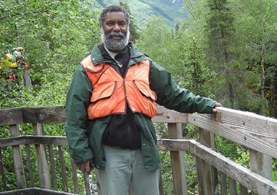 Robert Stovall, the deputy district ranger on the Seward Ranger District on Alaska’s Chugach National Forest, takes a moment to relax at the Russian River Falls Overlook. As a sport fisherman he enjoys hooking the big, aggressive silvers, also known as coho salmon. (U.S. Forest Service photo)