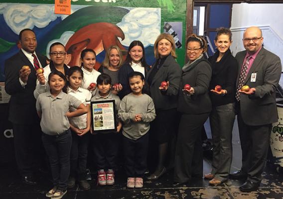 The Chicago Public Schools System has incorporated locally-grown produce into school menus, providing students with fresh, healthy food. (Administrator Anne Alonzo, 4th from right) USDA Photo Courtesy of Peter Wood.
