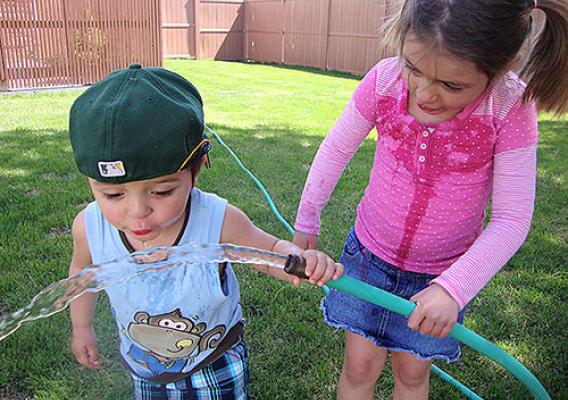 Kids playing with hose