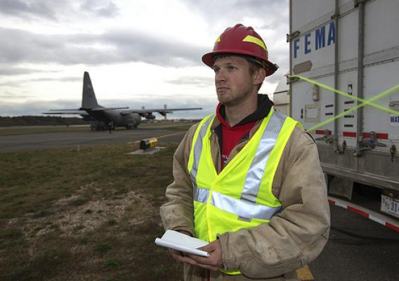 U.S. Forest Service employee Jordon Sanders from Harlan, IA., waits for military aircraft to drop off more supplies in response to Hurricane Sandy at the Republic Airport in Farmingdale, NY, on Thursday, Nov 1, 2012. USDA photo by Dave Kosling.