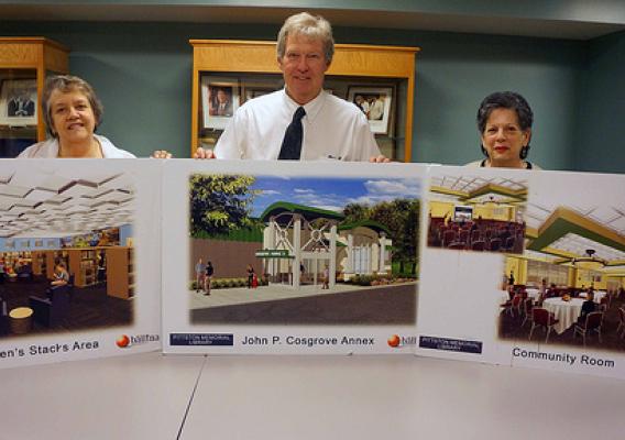 (L to R) Anne Hogya, Pittston Library Director , Thomas Williams, USDA Rural Development State Director, and Barbara Quinn, Library Board President, display artist renderings of the library expansion slated to begin this summer. USDA photos.