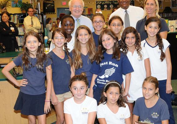 FNCS Under Secretary Kevin Concannon and FNS SERO Regional Administrator Don Arnette meet the Student Wellness Team from North Beach Elementary School, Miami Beach, Fla., during a recent visit to the school. (USDA photo by Debbie Smoot).