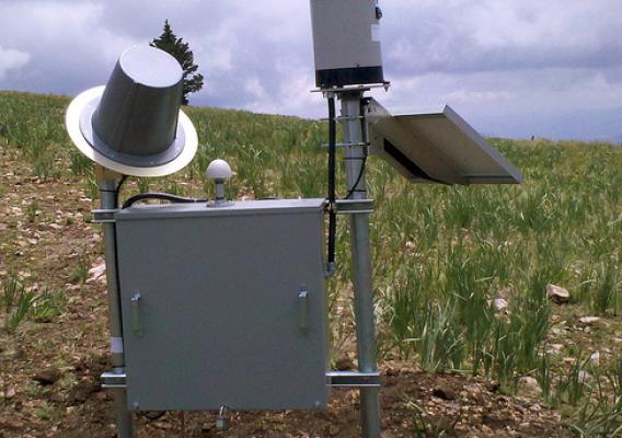 Buck Mountain precipitation gage with solar panel, radio stand, and electronics—Whitewater Baldy Complex Fire, N.M.