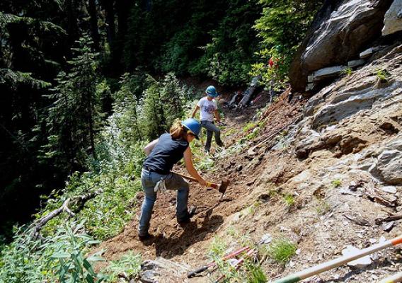 Amy Merrit of Oso, Wash., and Kim Woodward of Darrington, Wash., work on maintaining the Pacific Crest Trail on the Mt. Baker-Snoqualmie National Forest in Washington. (U.S. Forest Service photo)