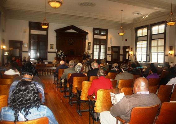 The inside of the newly restored courthouse and the attendees at the Grand Opening Ceremony. USDA photos.