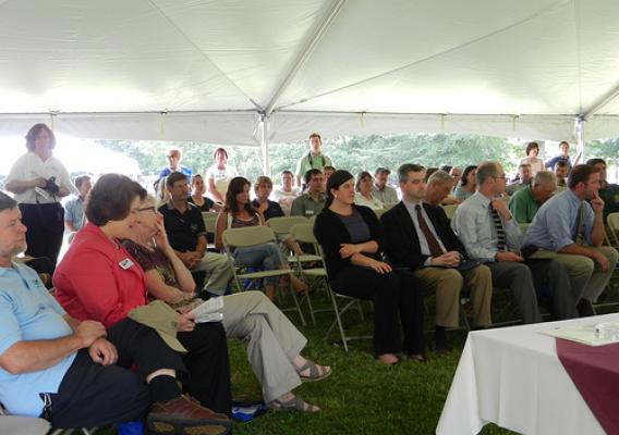 on left - Judith Canales, Acting Deputy Under Secretary for Rural Development in front row with Gregg MacPherson, Area Director and Molly Lambert, State Director – on right – congressional staff Ivey Jones-Congressman Bass, Sean Thomas-Congressman Guinta, Matt Leahy-Senator Shaheen, and Simon Thompson-Senator Ayotte with community attendees at the New Hampshire 150th USDA Anniversary Observance.