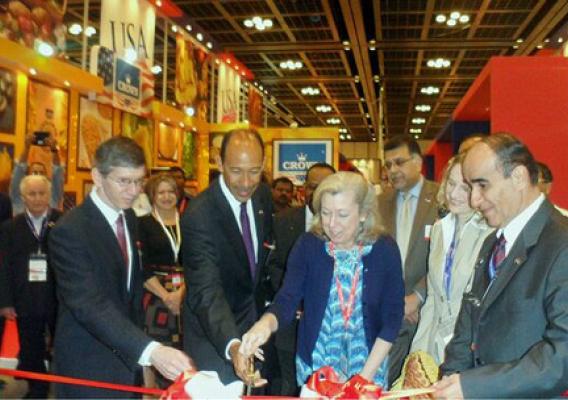 U.S. Ambassador to the United Arab Emirates Michael Corbin (second from left) and Foreign Agricultural Service (FAS) Administrator Sue Heinen cut a ceremonial ribbon during the opening ceremony for the USA pavilion at the 2013 Gulfood trade show as Consul General Rob Waller (far left) and the USA pavilion organizers exhibitors look on.