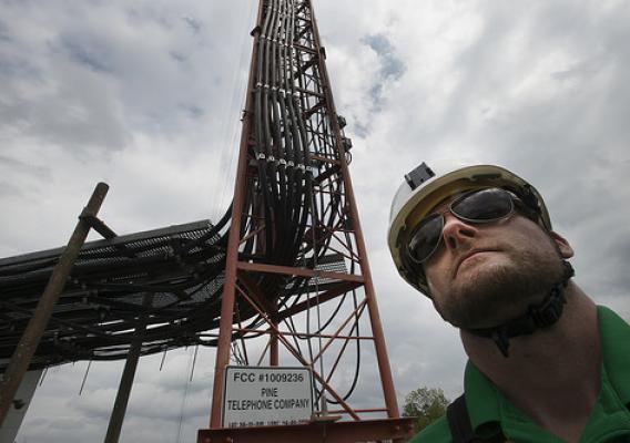 A Pine Net worker standing near a broadband tower that is part of the upgrade for the communications and broadband systems throughout the area with the assistance of the U.S. Department of Agriculture (USDA) in Broken Bow, OK
