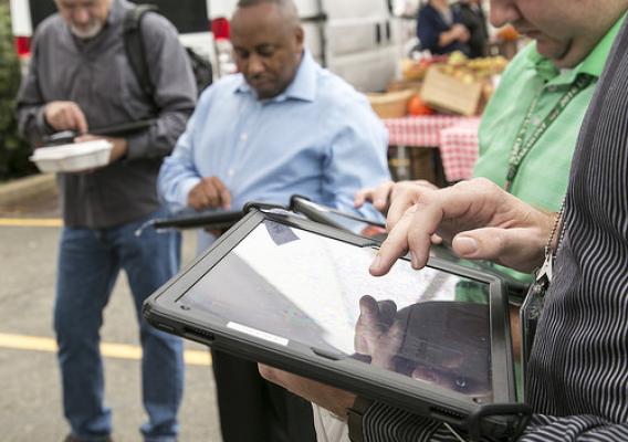 Visitors at USDA's Farmers Market on iPads