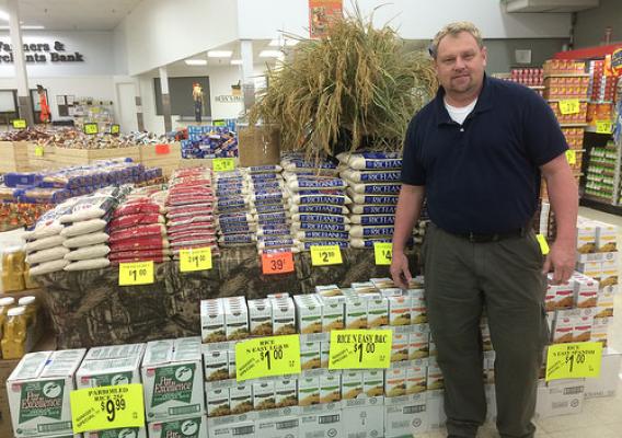 Glenn Buffkin, store manager of Mayflower Foods with a special display of rice products