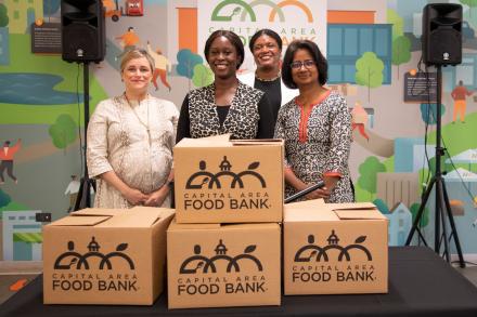 Left to Right: USDA Deputy Assistant Secretary for Administration Kimberly Peyser; Capital Area Food Bank Client Rebecca Williams;  Feds Feed Families 2022 National Chair Angela French-Bell; and Capital Area Food Bank President and CEO Radha Muthiah