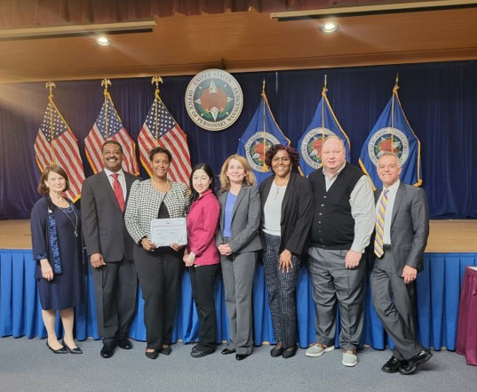 Pictured left to right: Ann Van Houten (CFCNCA), Keith Willingham (CFCNCA), Kurtria Watson (USDA FNS), Erika Pijai (USDA FNS), Andrea Simao (APHIS, USDA CFC Deputy Campaign Manager), Angella Watkins (USDA FNS), Robert Pitulej (FNS; USDA CFC Campaign Manager), Traci Mouw-not pictured (USDA FNS), and Vince Micone (CFCNCA) at the Awards Ceremony at the Office of Personnel Management
